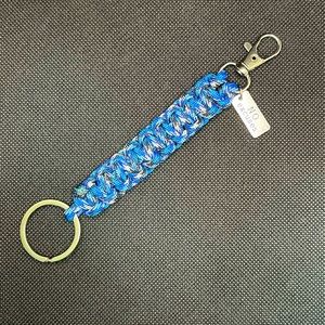 Blue, Black & White Paracord keychain with clip and charm.